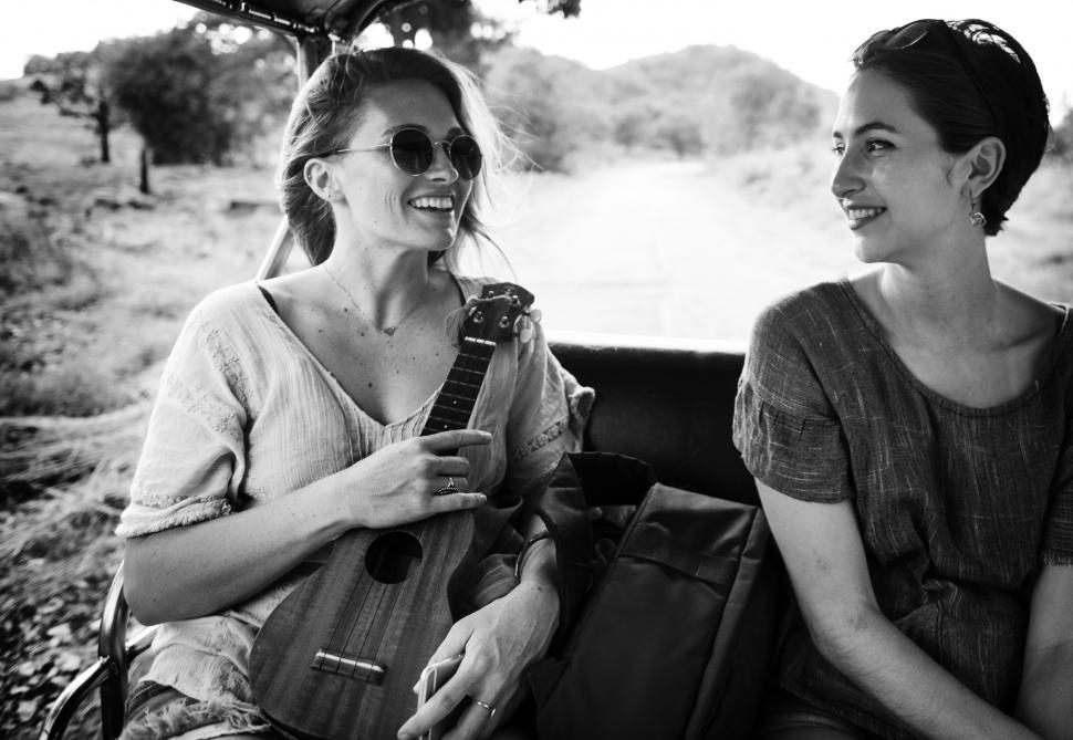 Free Image of Two Women Sitting Together 