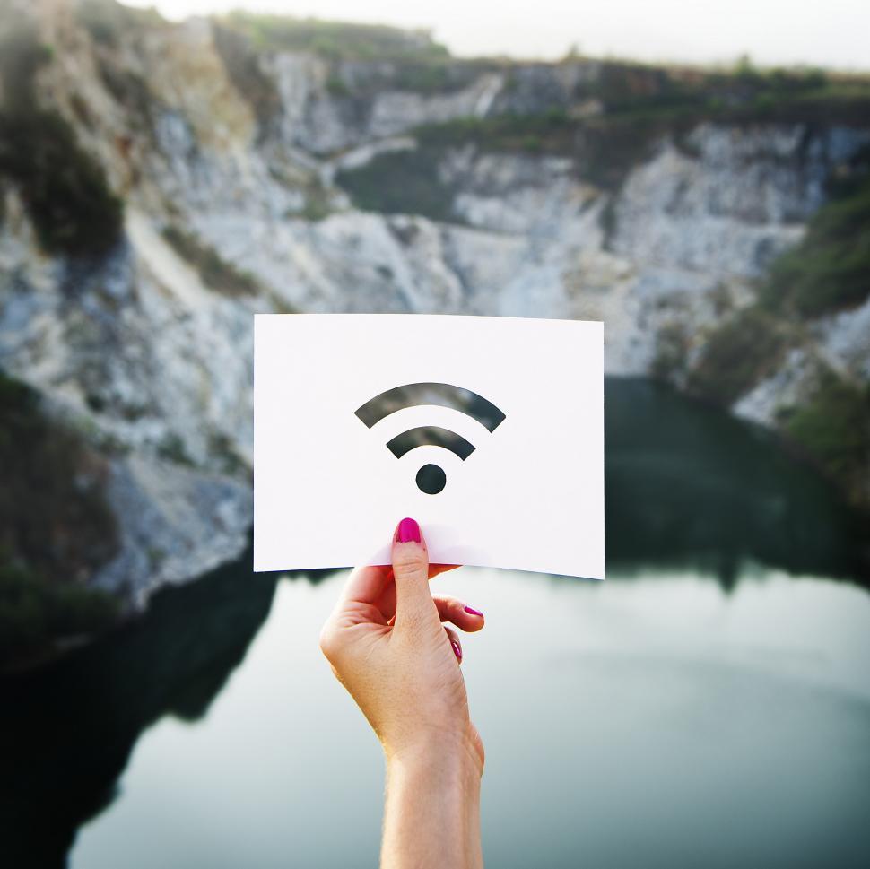 Free Image of Person Holding Paper With Wifi Symbol 