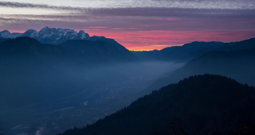 Free Image of Majestic Mountain Range Silhouetted at Sunset 
