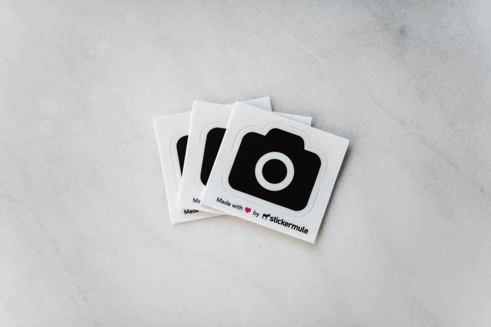 Free Image of Three Camera Stickers on Table 