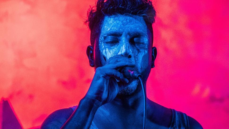 Free Image of Man With Blue Paint on Face 
