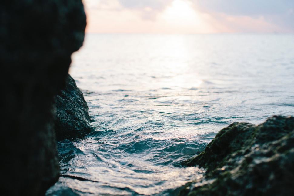 Free Image of A Glimpse of the Ocean From a Rocky Outcropping 