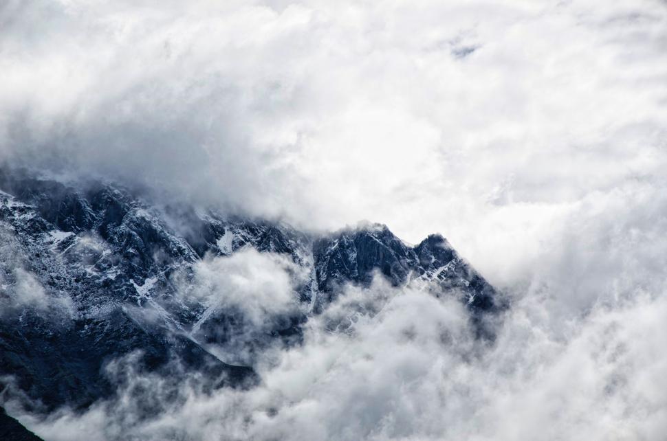 Free Image of Cloud-covered Mountain Summit 