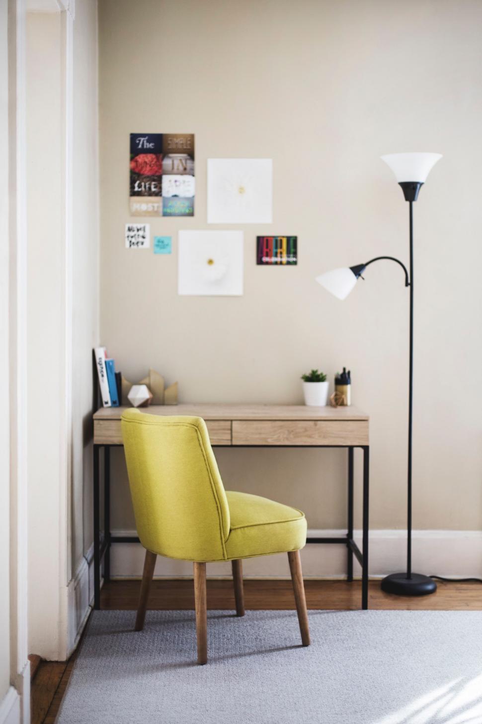 Free Image of Yellow Chair in Front of Desk 