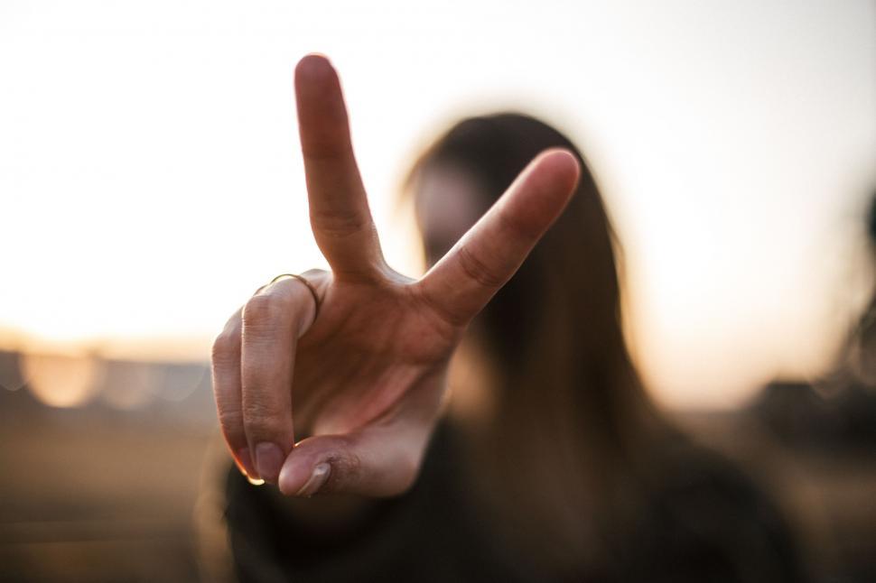Free Image of Person Making a Peace Sign 