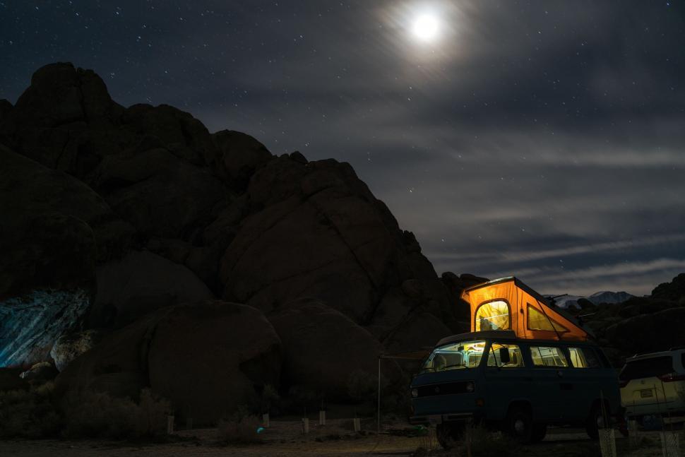 Free Image of Van Parked in Front of Mountain Under Full Moon 