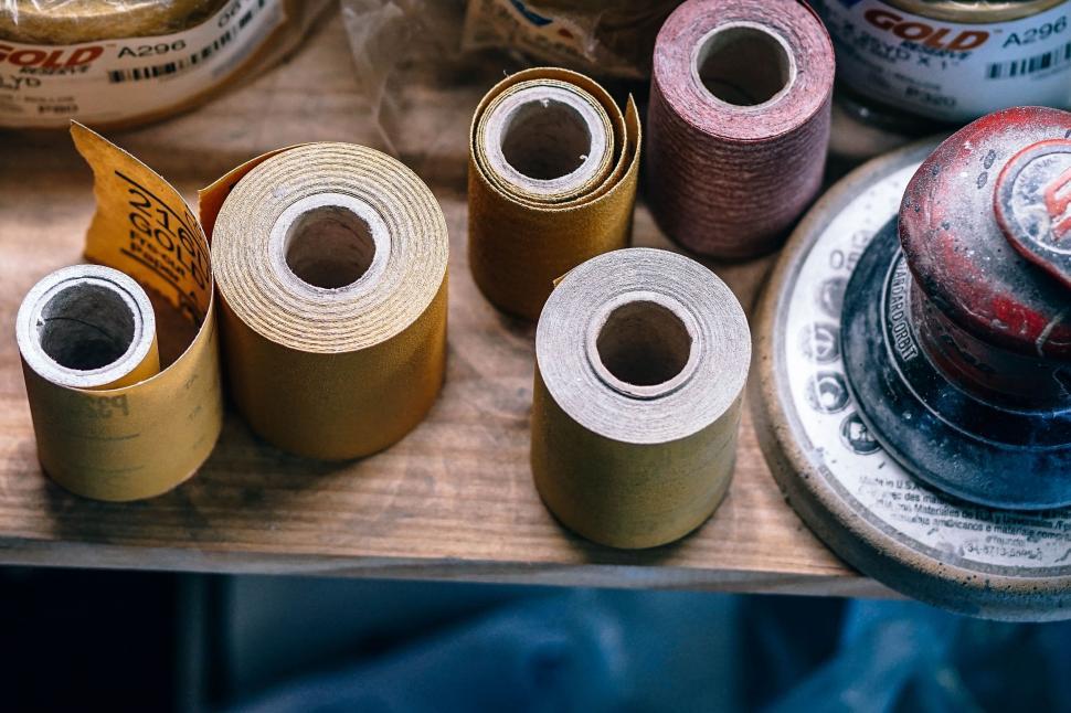 Free Image of Several Spools of Thread on Wooden Table 