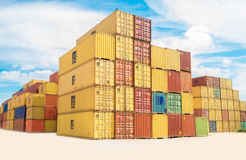 Free Image of Massive Stack of Containers on Sandy Beach 