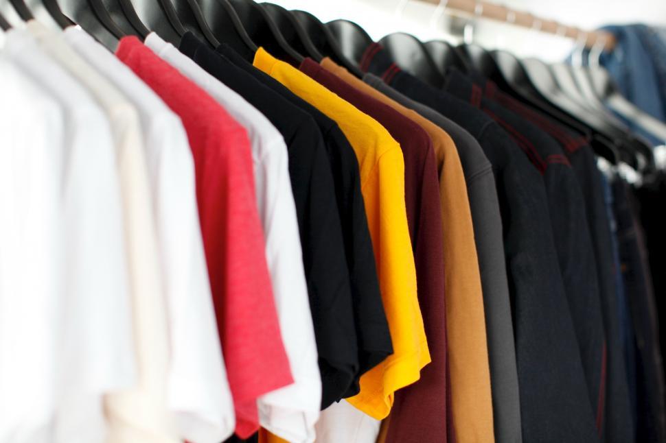 Free Image of Assorted Shirts Hanging on a Clothes Rack 