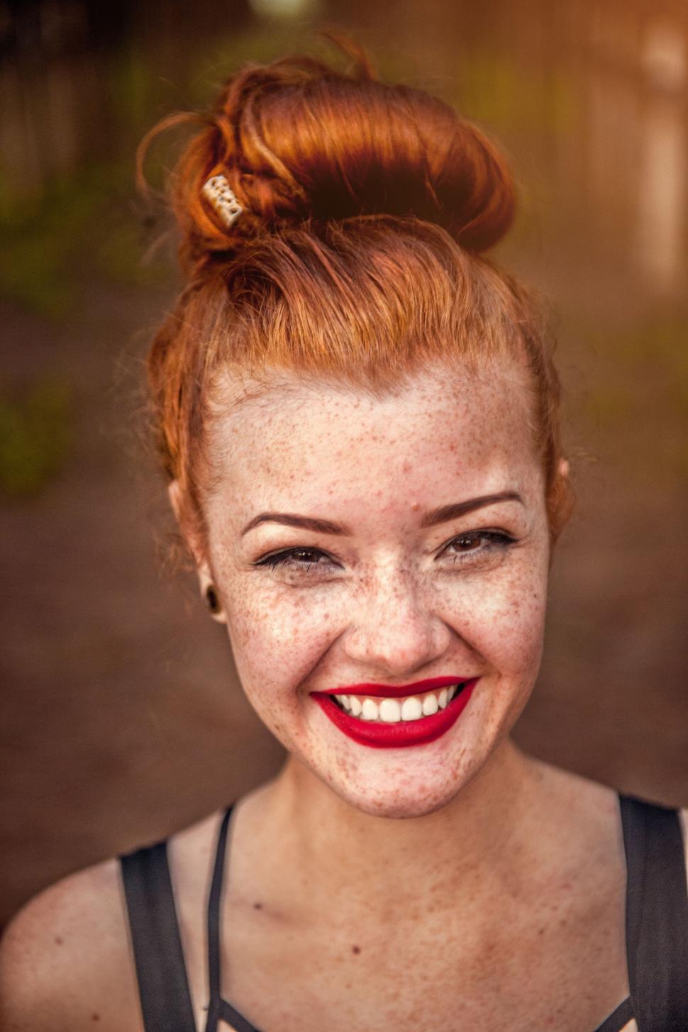 Free Image of Woman With Freckled Hair and Bow in Hair 