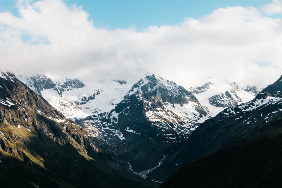 Free Image of Snow-Covered Mountains With Clouds 