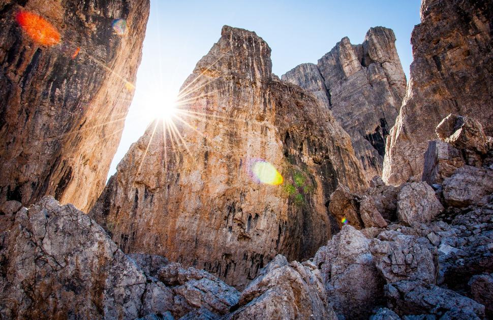 Free Image of Sun Shines Through Rocks in the Mountains 