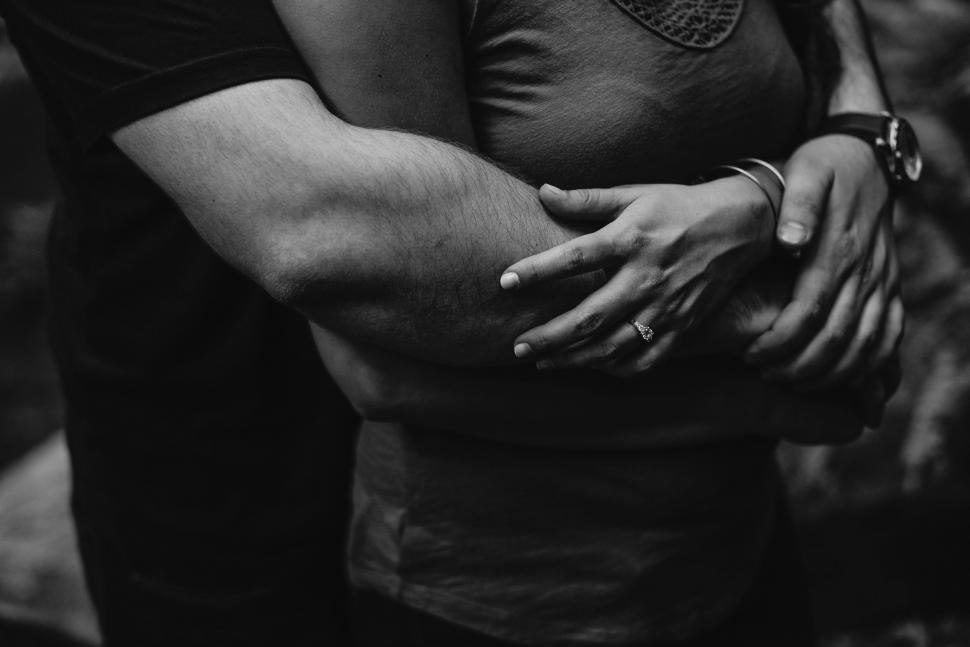 Free Image of Man Hugging Woman in Black and White 