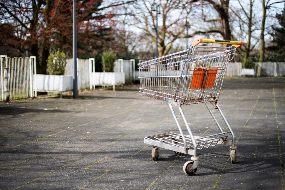 Free Image of Abandoned Shopping Cart in Parking Lot 