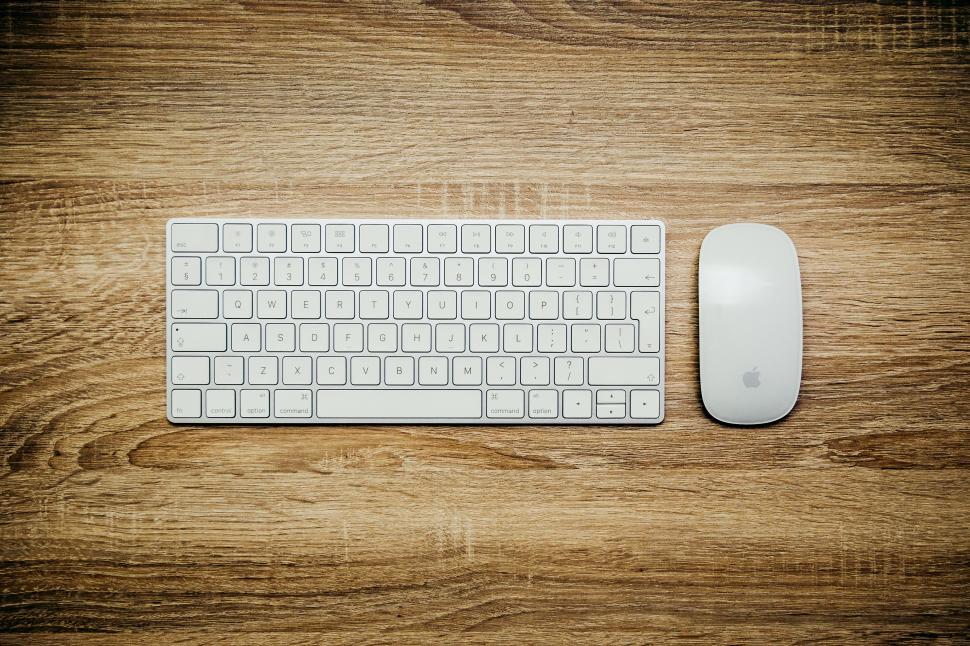 Free Image of Computer Keyboard and Mouse on Wooden Table 