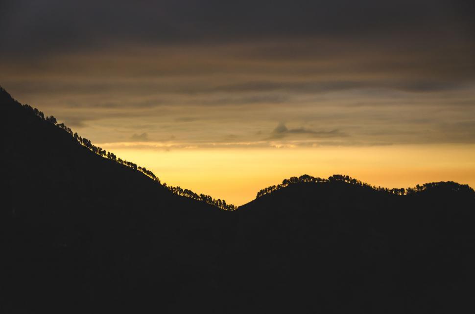Free Image of Sun Setting Over Mountains 
