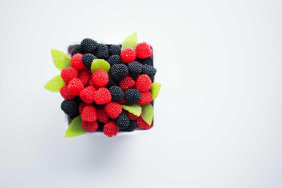 Free Image of Assortment of Raspberries and Blackberries on White Surface 