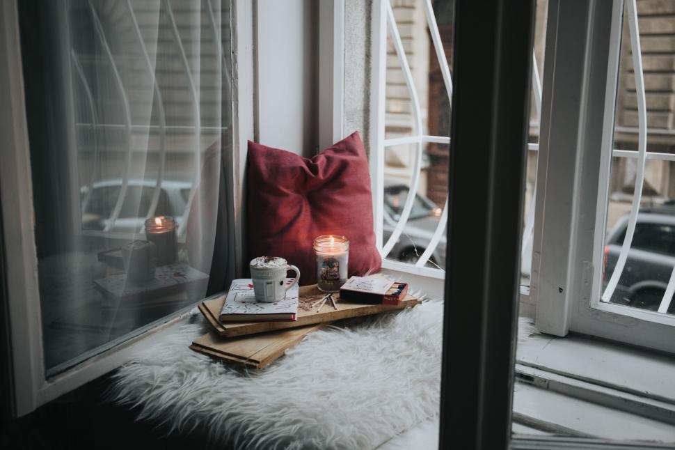 Free Image of Window Sill With Book and Candle 