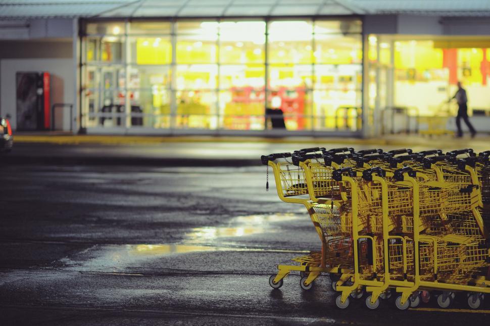 Free Image of Row of Yellow Shopping Carts Outside Store 