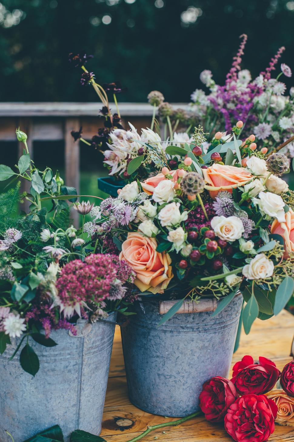 Free Image of Table With Two Buckets of Flowers 
