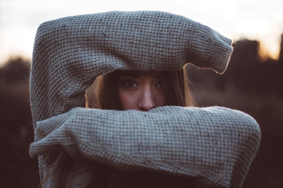 Free Image of Woman Covering Face With Blanket 