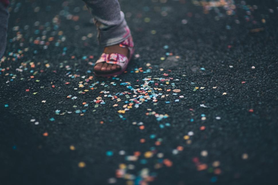 Free Image of Person Standing on Street With Confetti 