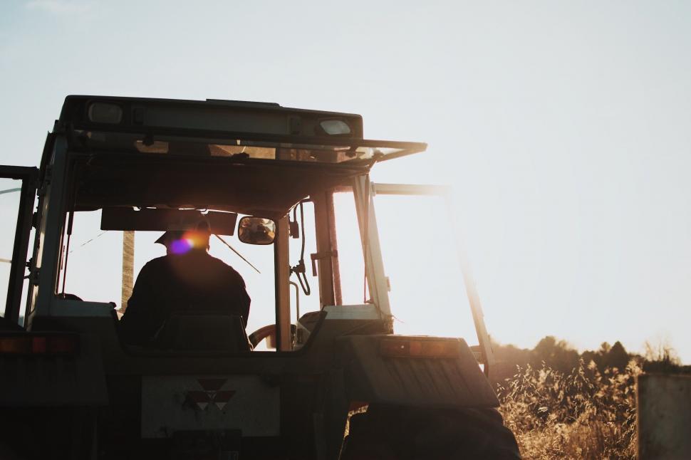 Free Image of Person Driving Tractor in Field 