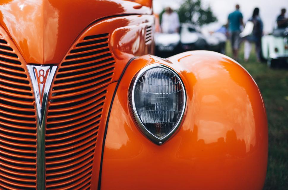 Free Image of Close Up of the Front of an Orange Car 