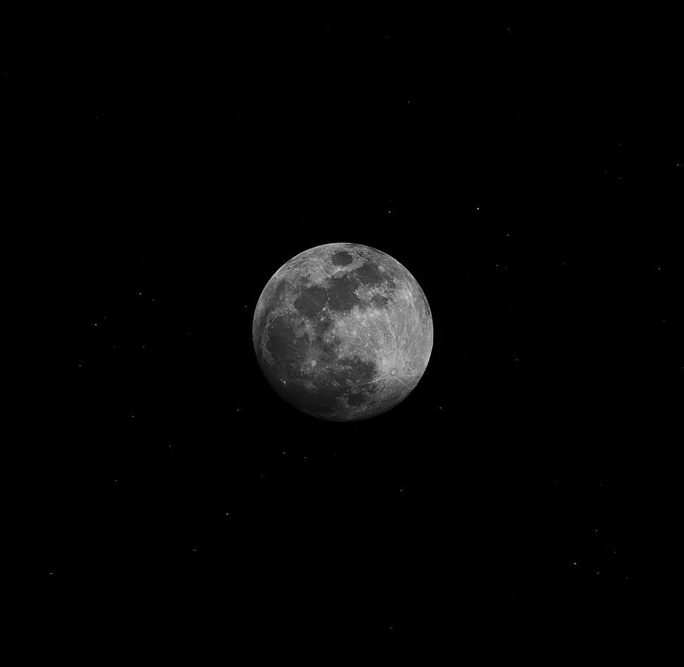 Free Image of Full Moon Peeking Through Dark Sky 
