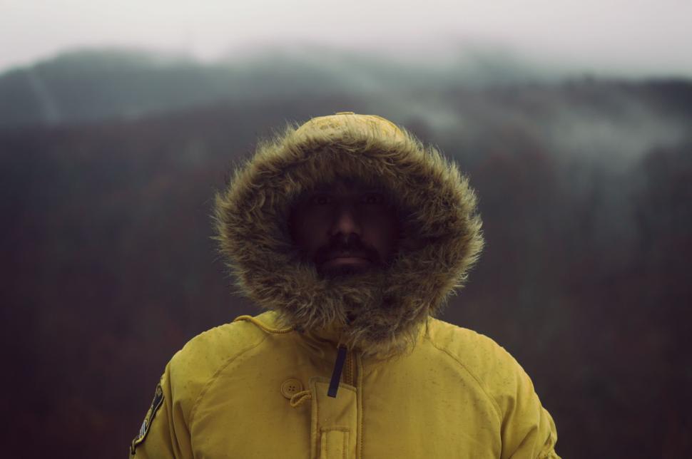 Free Image of Person Wearing Yellow Jacket With Hood 