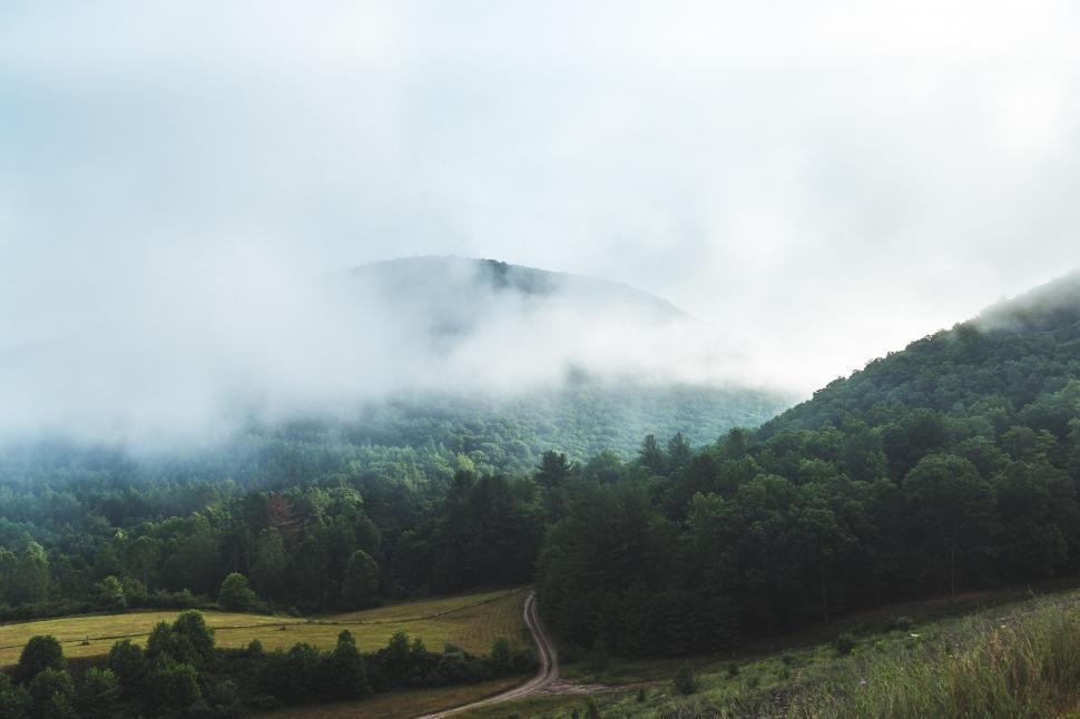 Free Image of Foggy Mountain With Winding Road 