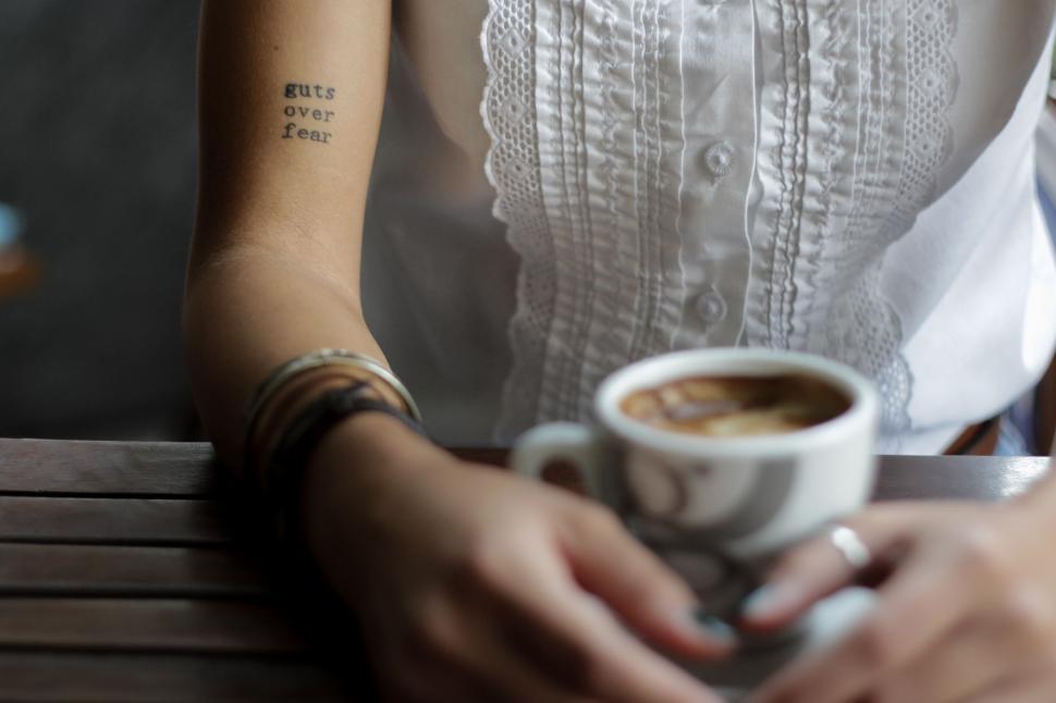Free Image of Woman Holding Cup of Coffee 