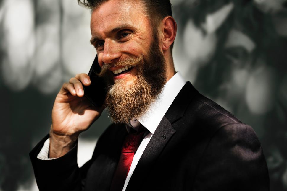 Free Image of Businessman in Suit Talking on Cell Phone 