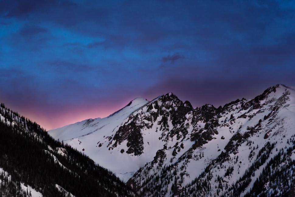 Free Image of Snow-Covered Mountain Under Purple Sky 