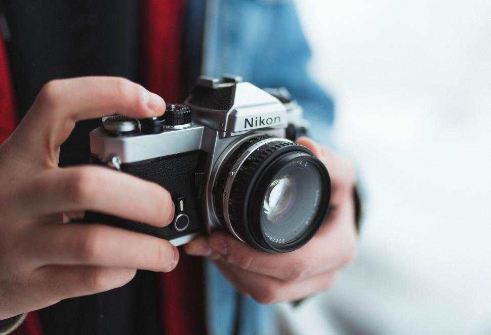 Free Image of Person Holding a Camera in Their Hands 