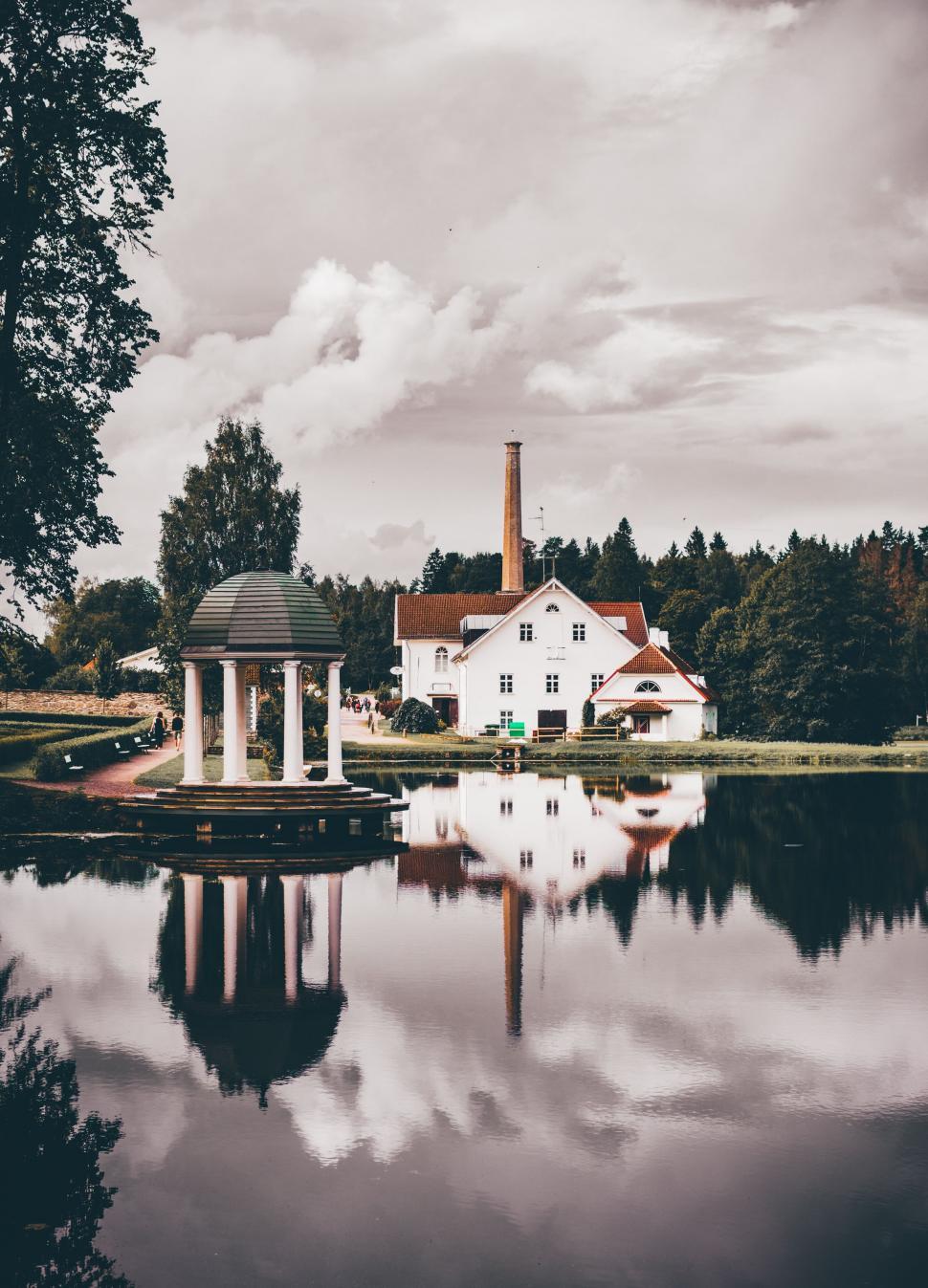 Free Image of White House by Lake Next to Forest 