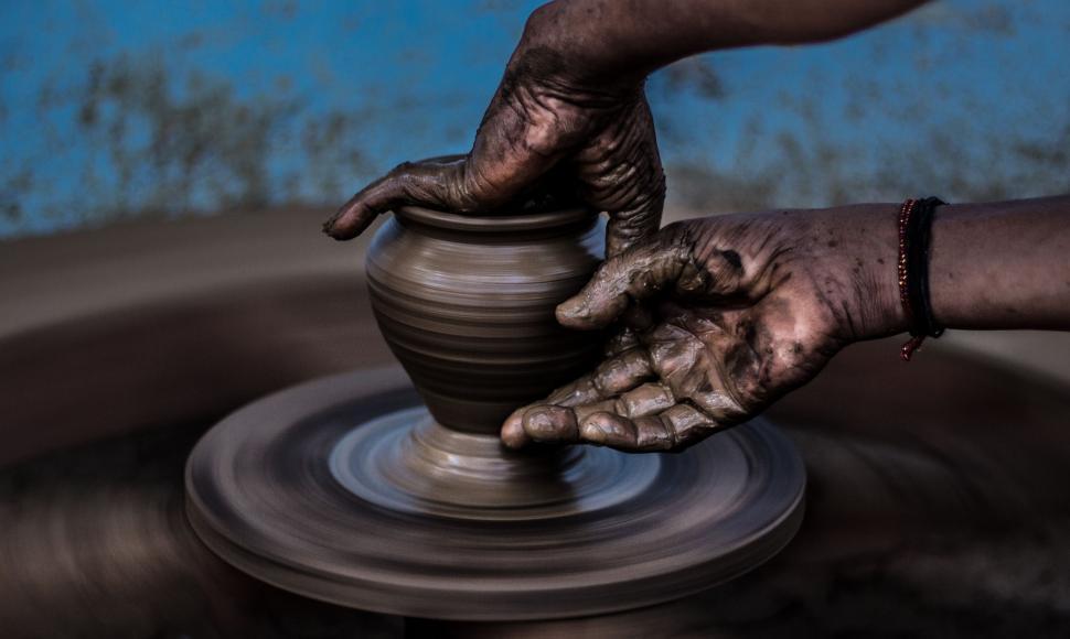 Free Image of Person Making a Pot on Potters Wheel 