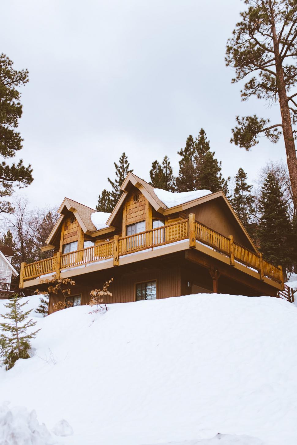 Free Image of House on a Hill Covered in Snow 