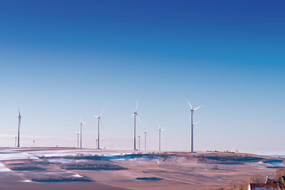 Free Image of Group of Windmills Standing in the Dirt 