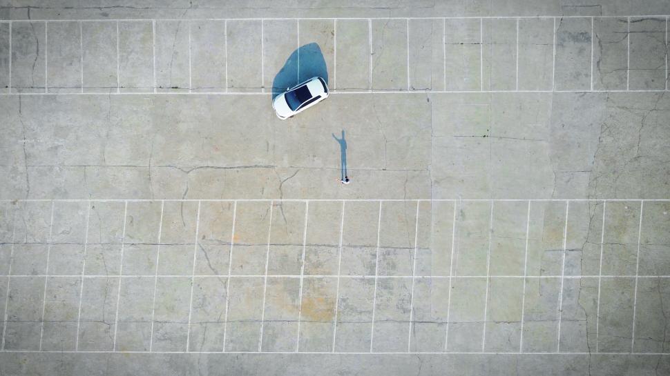 Free Image of Aerial View of a Car Parked in a Parking Lot 