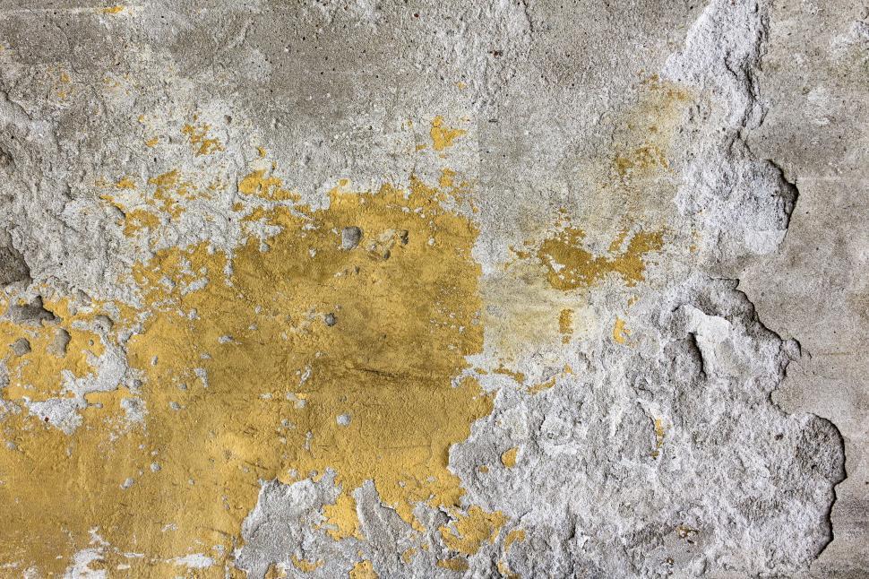 Free Image of A Yellow and Gray Wall With Peeling Paint 