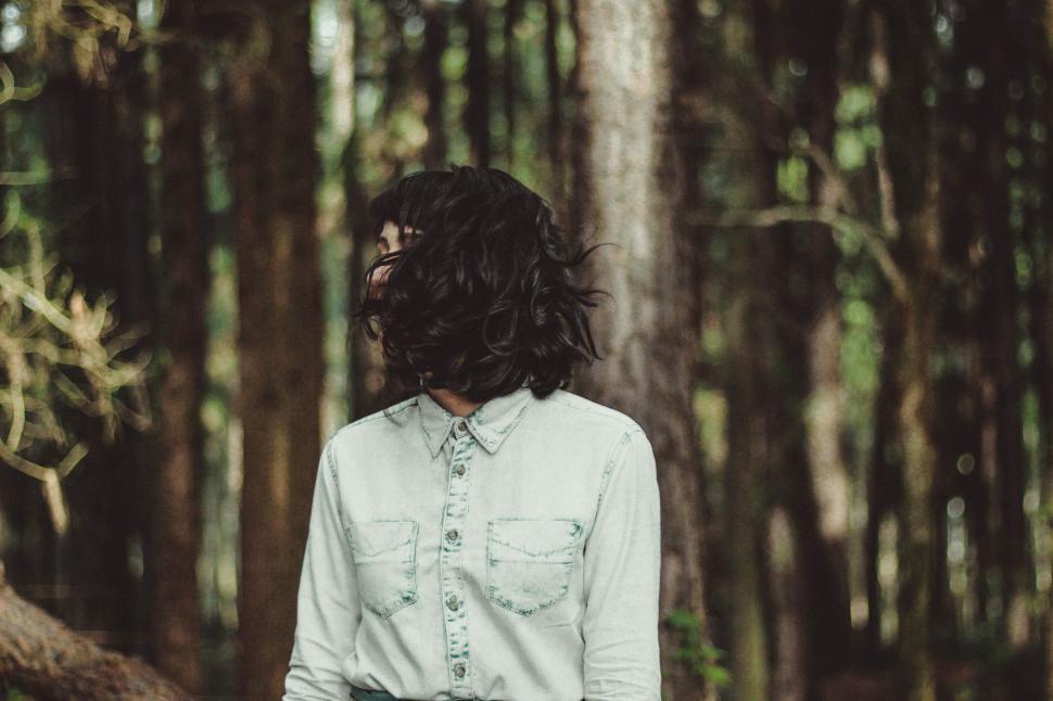 Free Image of Person Standing in Forest With Long Hair 