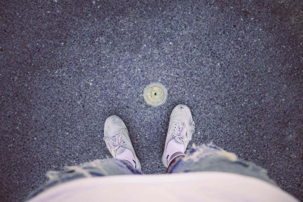 Free Image of Person Standing Next to Button on Ground 