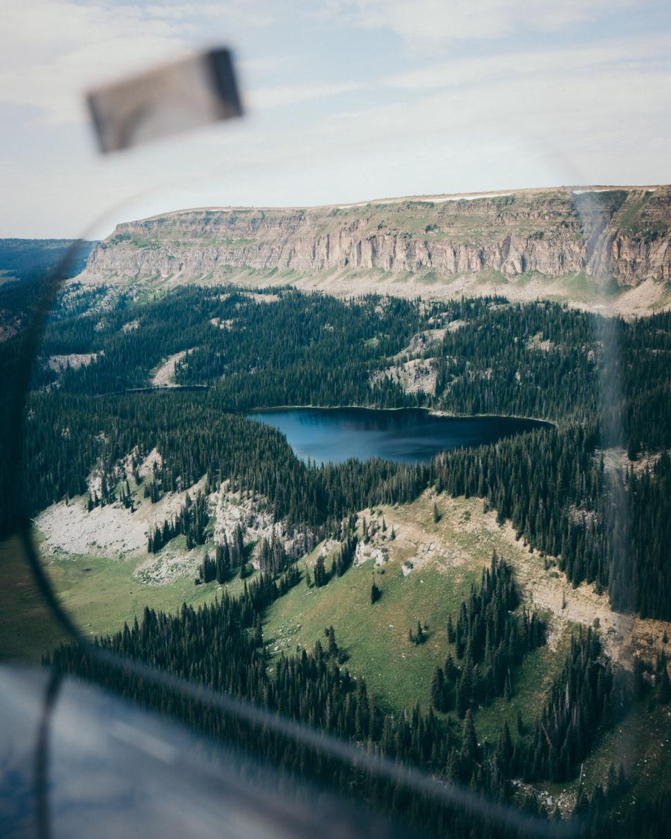 Free Image of A View of a Lake From a Plane Window 