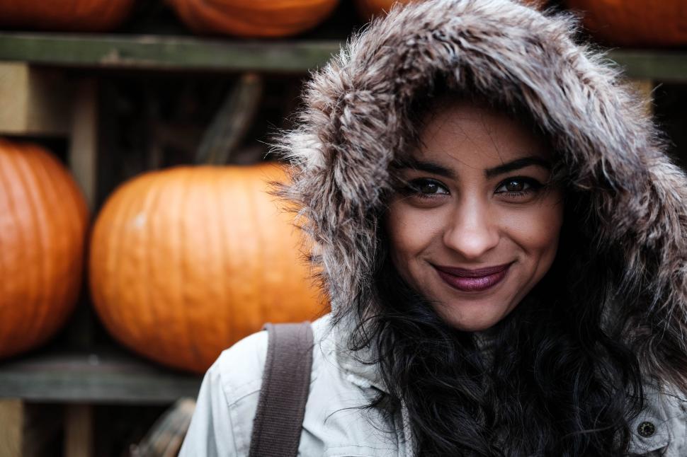 Free Image of Woman Smiling in Furry Hat 