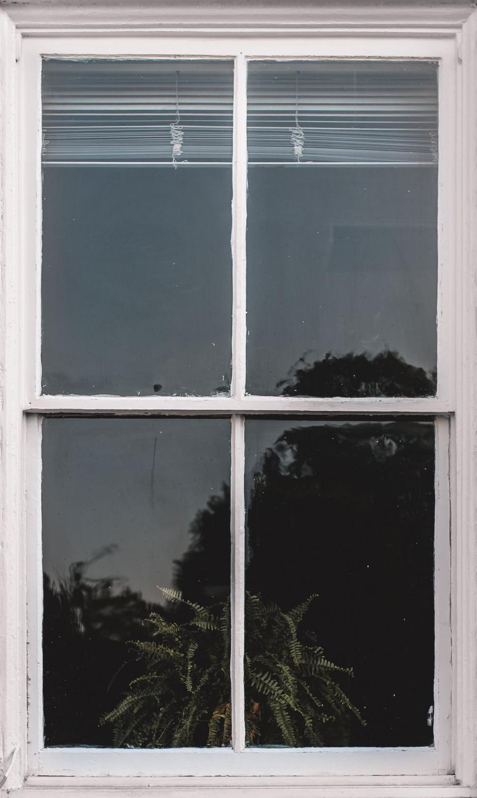 Free Image of A Black and White Photo of a Window 