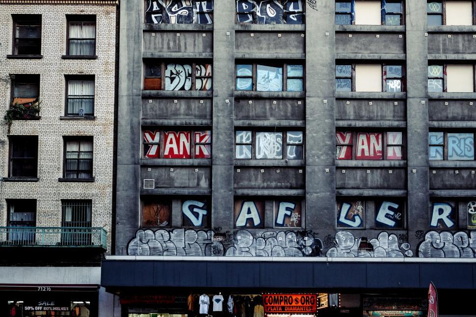 Free Image of Tall Building With Graffiti 
