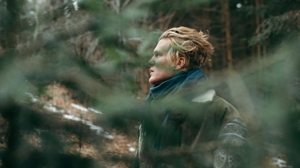 Free Image of Man With Blonde Hair Standing in the Woods 