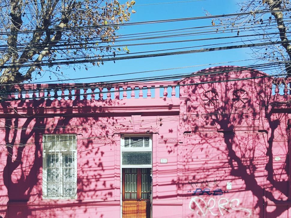 Free Image of Pink Building With Graffiti 