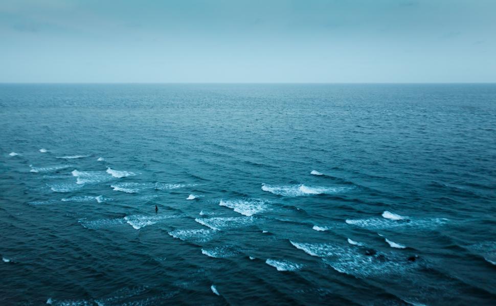 Free Image of Vast Water Body Encircled by Waves 